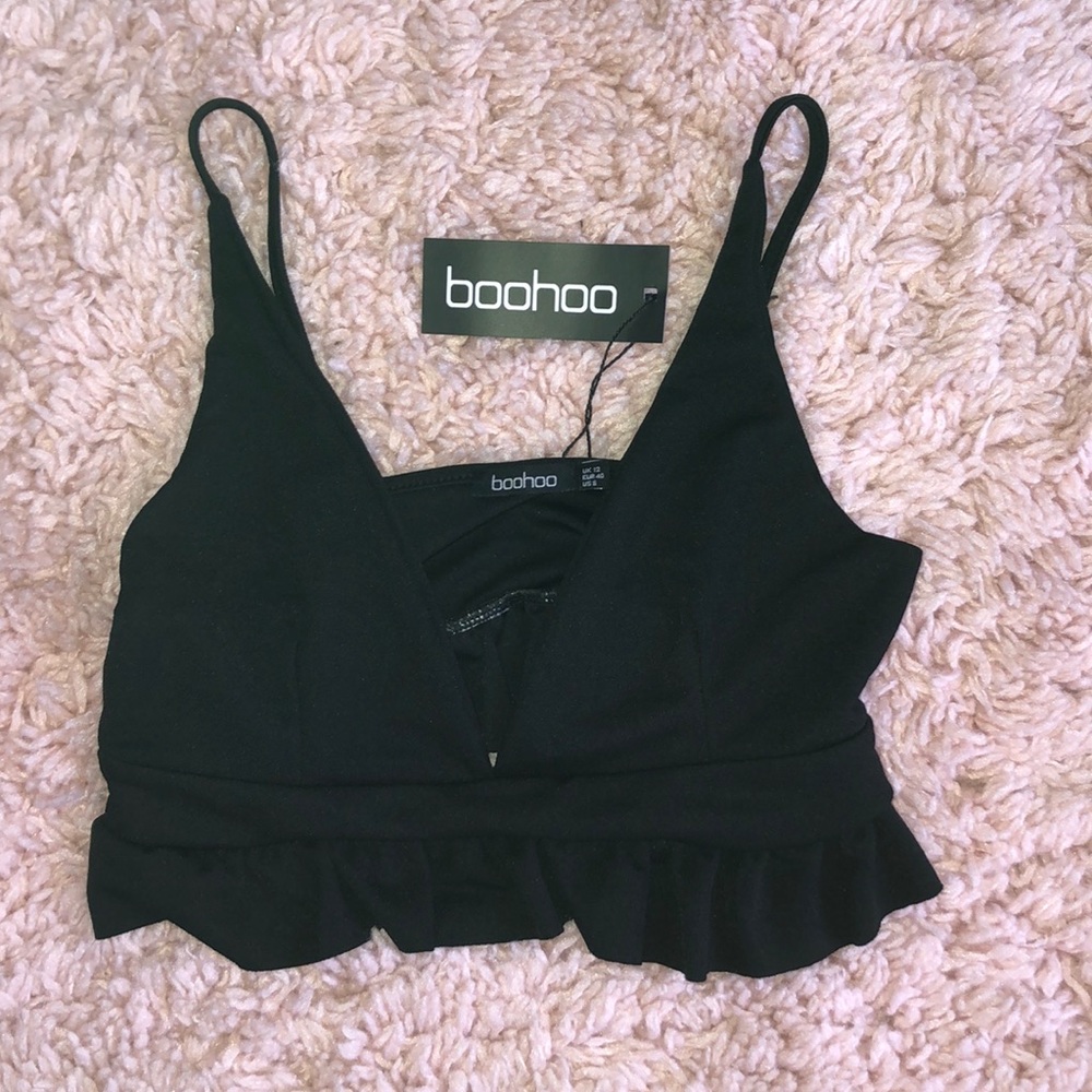 Black Ruffled Bottom Crop Tank Top from BooHoo